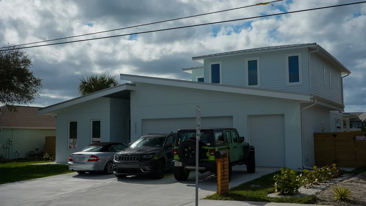 Completed painting in Spruce Creek FL, showcasing serene landscape with greenery, water, and inviting studio space.