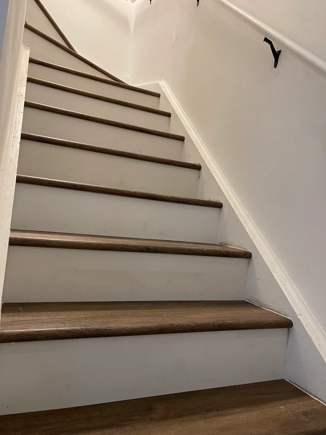 Soundproof underlayment installation in Darien IL featuring polished hardwood, natural light, and neutral walls.