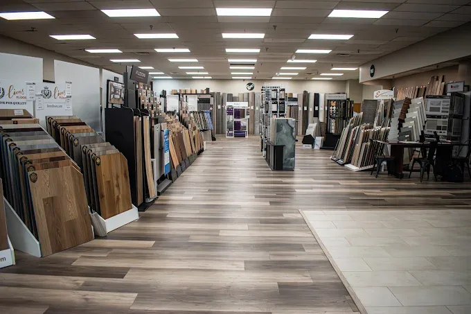 Showroom in Oklahoma City featuring diverse flooring options like hardwood and tile in a warm and inviting space.