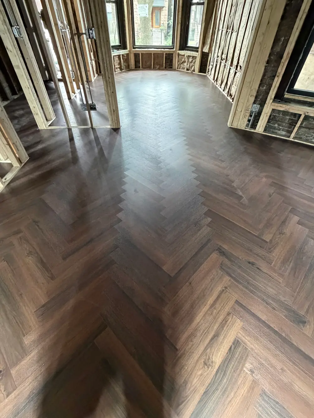 Self-Leveling Underlayment Installation projects in Darien IL showing workers applying the material on a floor.