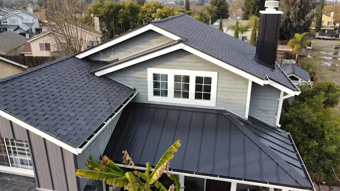 Modern attic ventilation with sleek ridge and eave vents in a well-maintained suburban Modesto home under bright daylight.