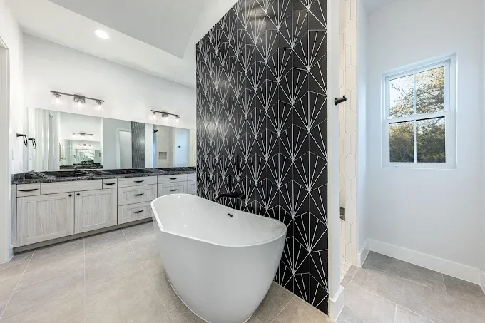 Completed home remodeling in Volente TX featuring a modern kitchen and elegant living room with tranquil views.