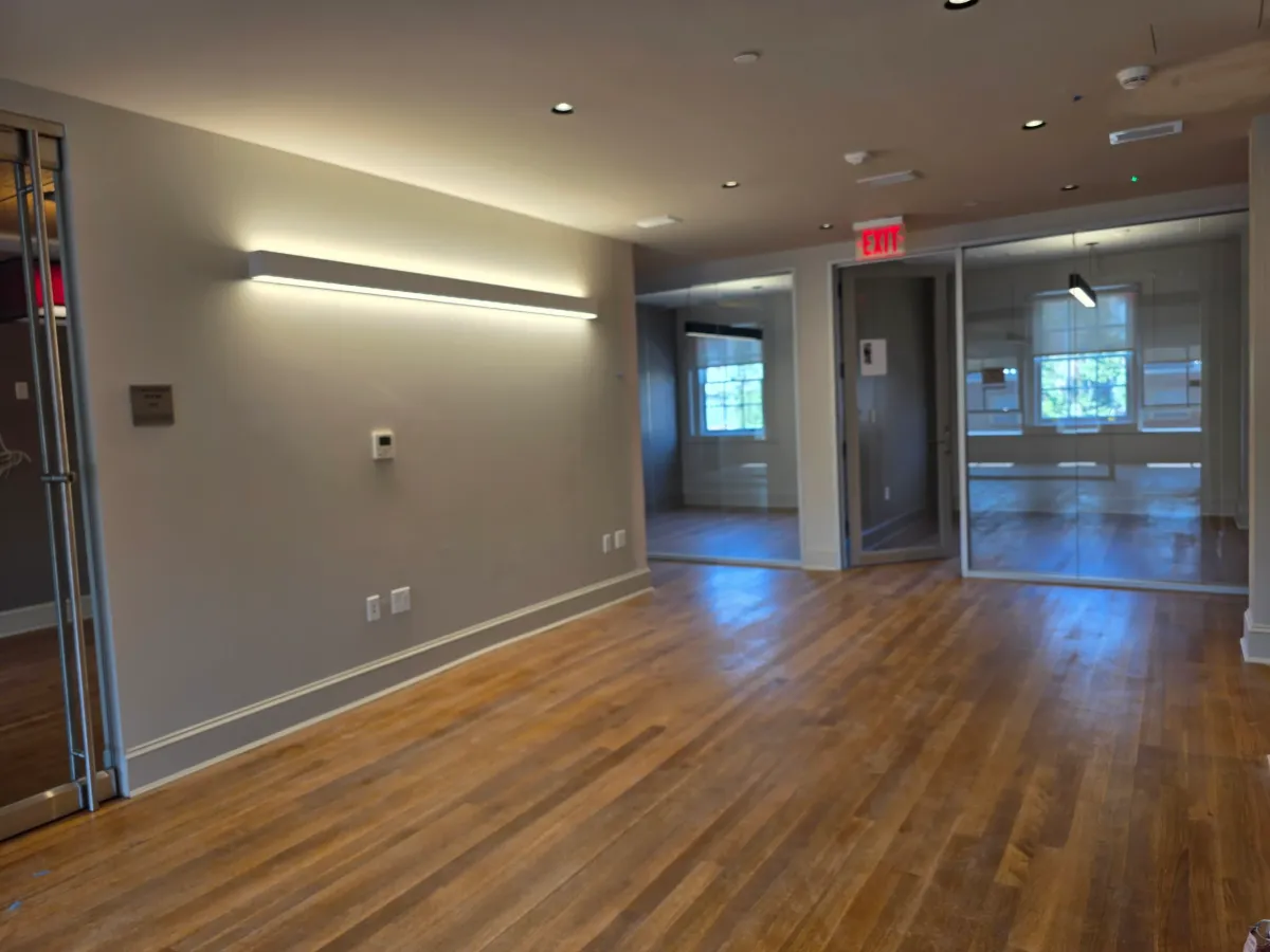 Spacious living area in Quantico VA showcases gleaming hardwood floors, elegant furniture, and soft natural light.