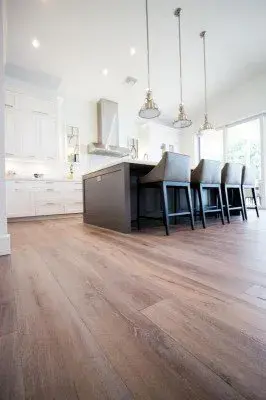 Beautiful wood flooring installation in Matlacha FL showcasing warm tones, intricate grain, and stylish decor elements.