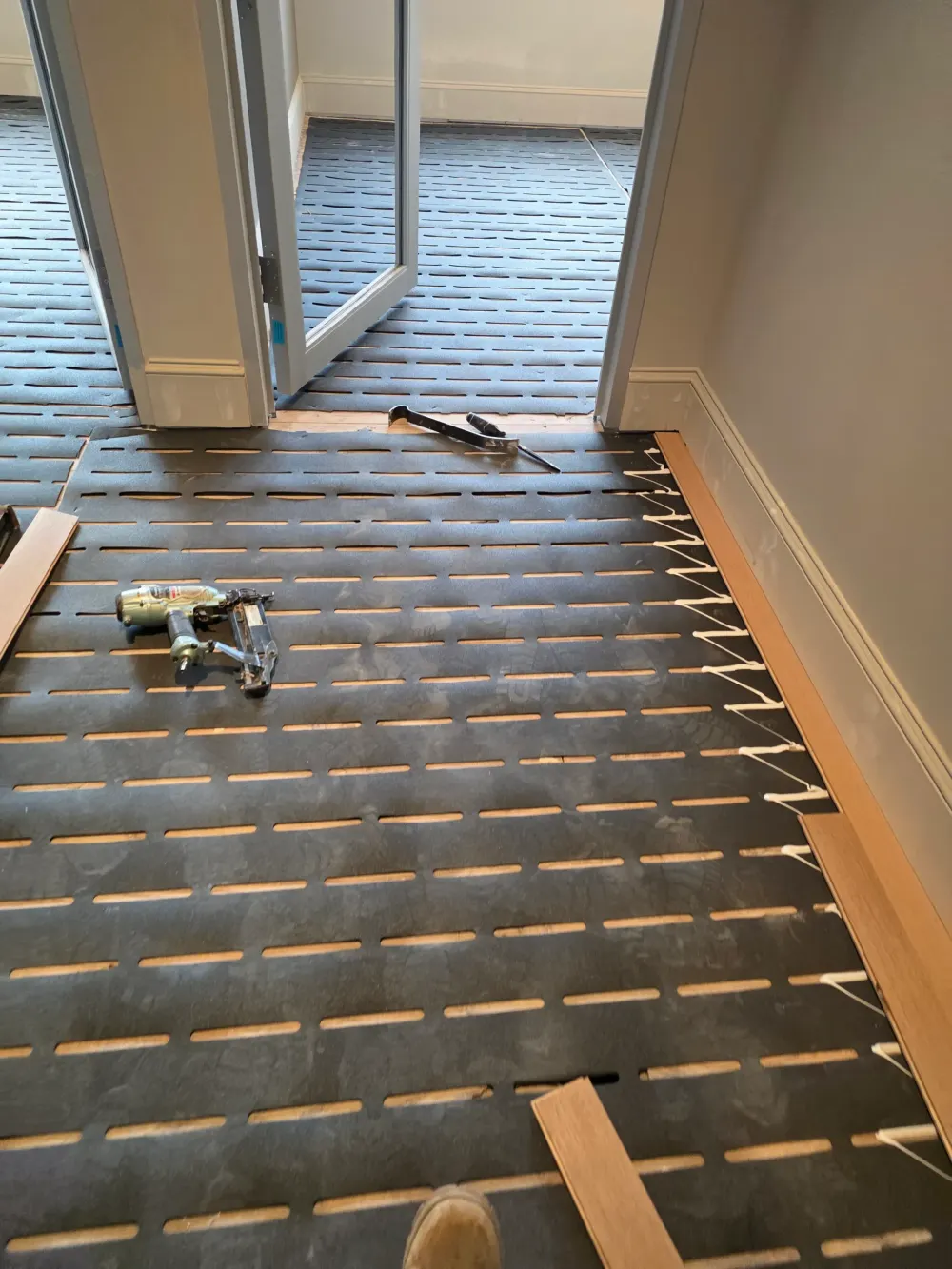 LVP flooring installation over concrete in a modern Centreville VA home with natural light and stylish decor.