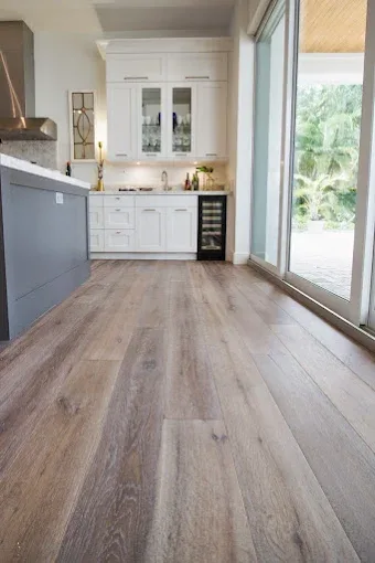 Wood flooring installation in Matlacha, FL with warm tones, intricate grain, elegant decor, and coastal vibe.