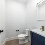 Luxurious modern bathroom in Austin with marble soaking tub, glass shower, double vanity, LED mirror, and elegant finishes