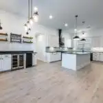 Modern kitchen remodel in Austin featuring sleek cabinetry, granite countertops, stainless appliances, and natural light.