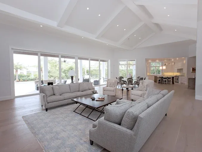 Restored hardwood floor in a modern living room in Naples FL showcasing rich tones and elegant decor.