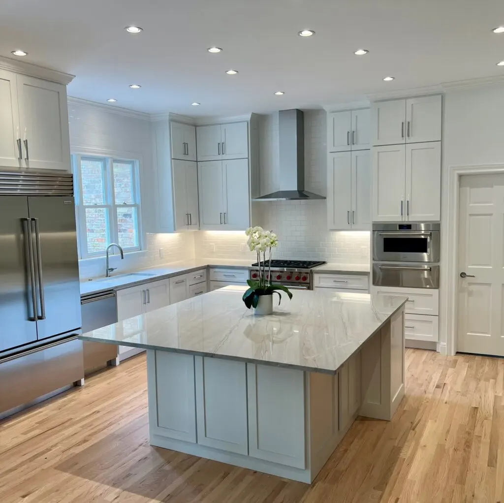 Modern Austin kitchen with sleek matte cabinets stainless steel appliances quartz counters and a central granite island