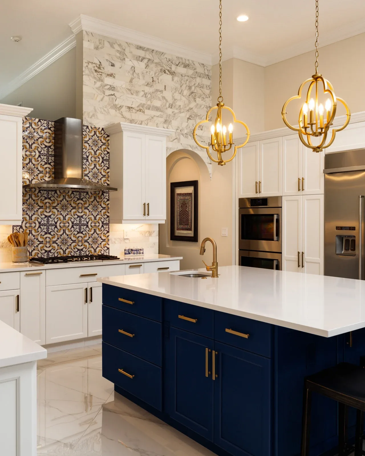 Modern remodeled Fort Worth kitchen with sleek cabinetry, marble island, high-end appliances, energy-efficient windows, hardwood floors, subway tiles, and stylish breakfast nook