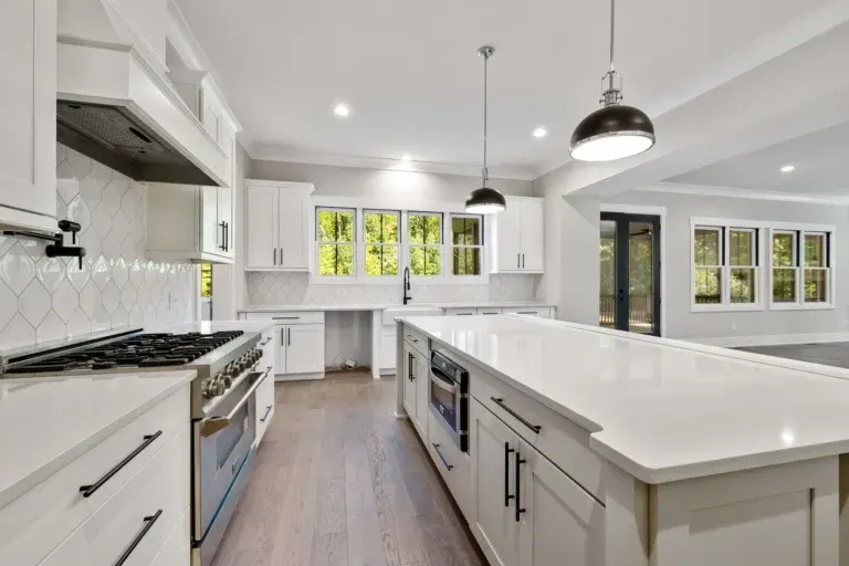 Renovated Fort Worth Texas kitchen with modern wood cabinetry stainless appliances granite countertops and large windows