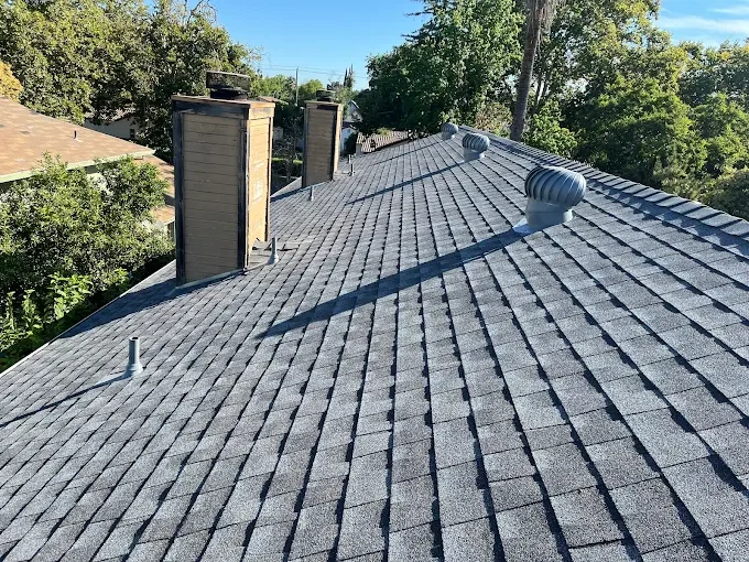 Freshly completed chimney flashing repair on a house in Modesto with seamless metal installation and detailed craftsmanship