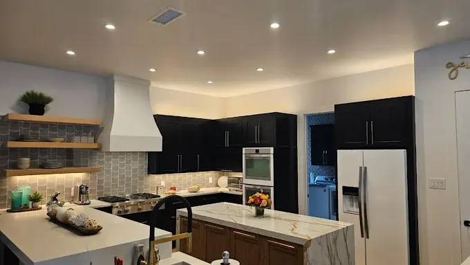 New Fort Worth remodel featuring sleek LED recessed lighting in a modern, open-concept interior with hardwood floors and stylish decor
