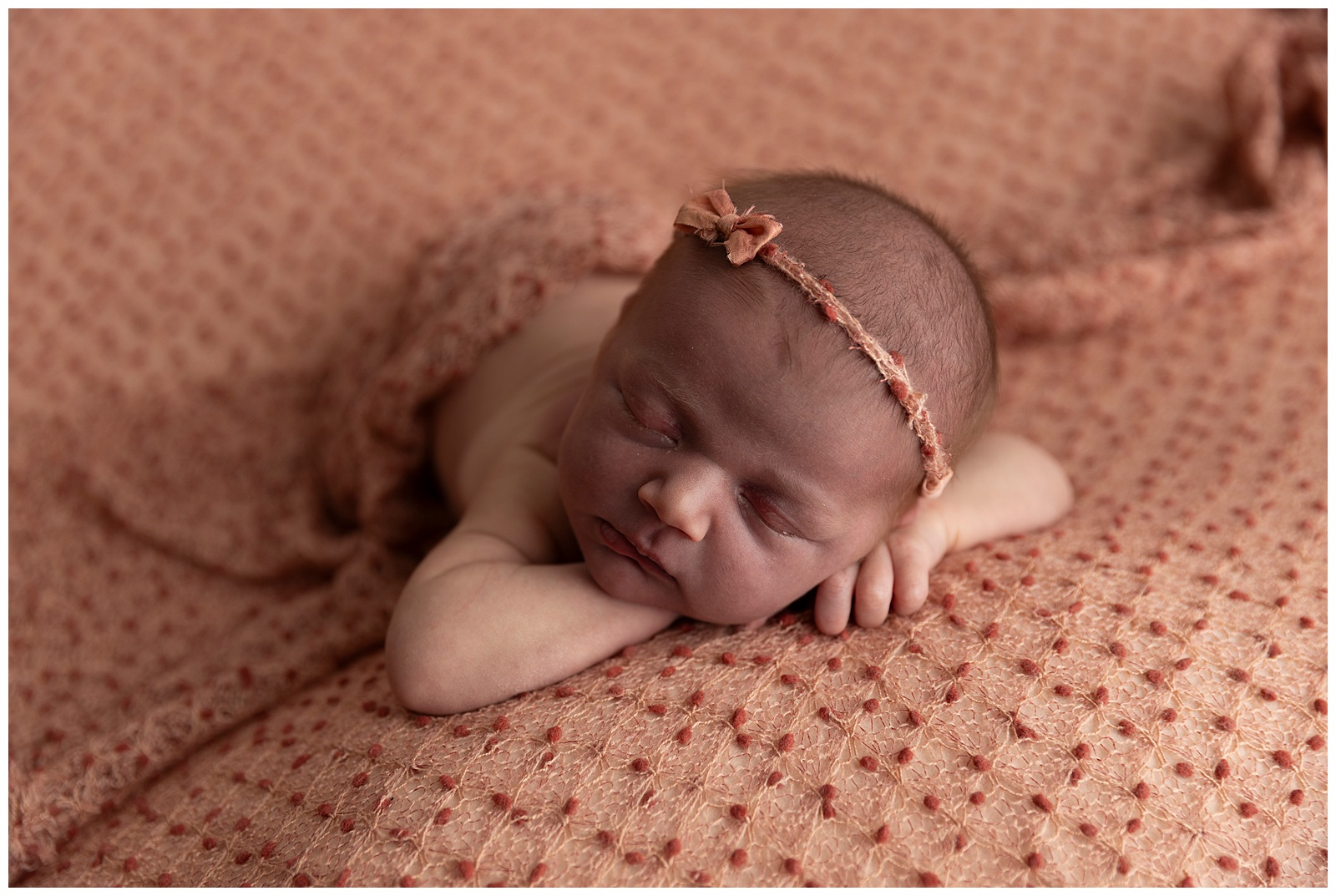 Underexposed newborn photo before editing and color correction