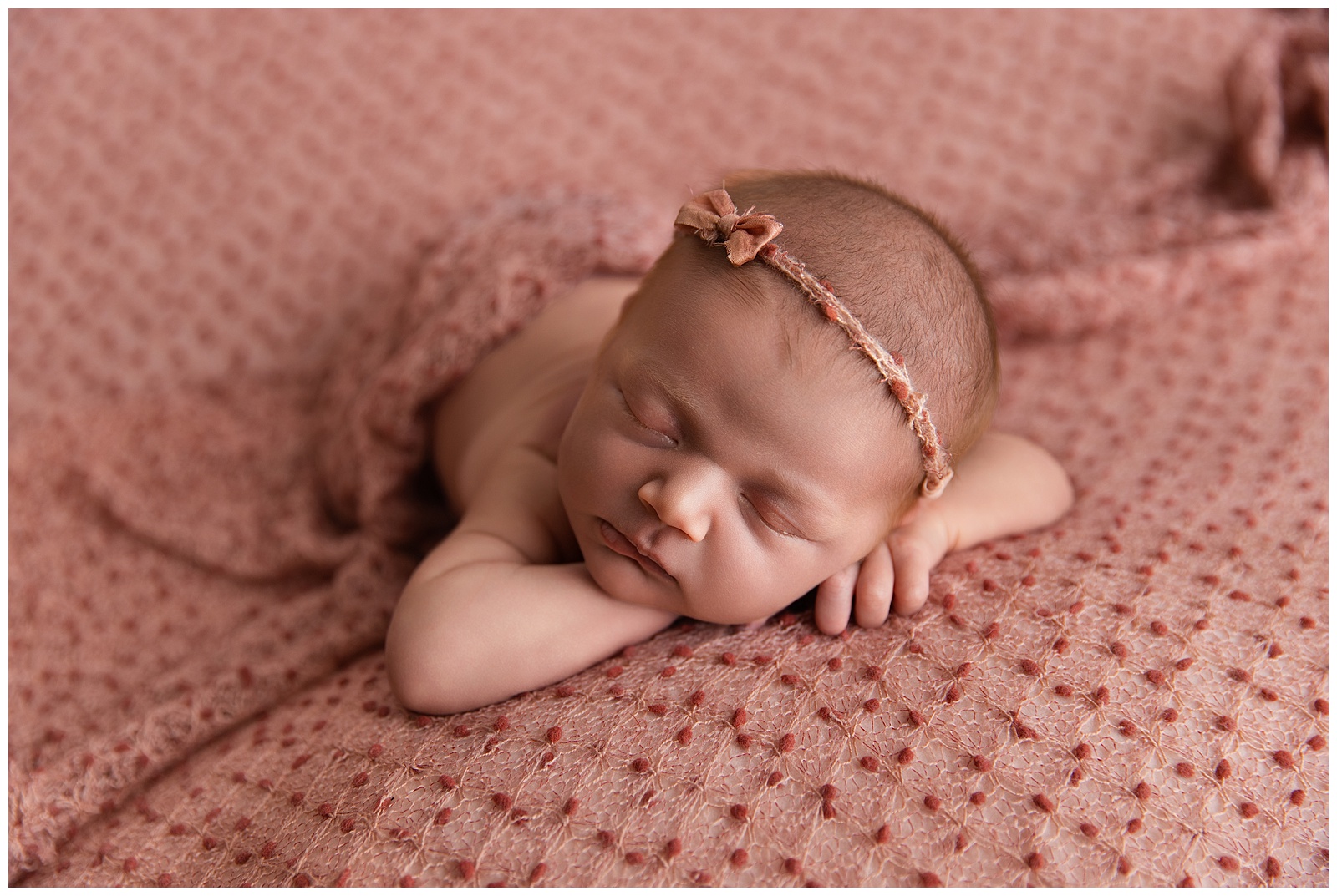 Newborn photo after correcting underexposure and color problems