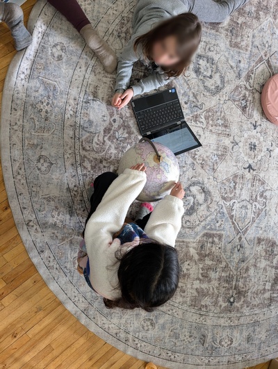 Learning with a globe and laptop in a dynamic work environment