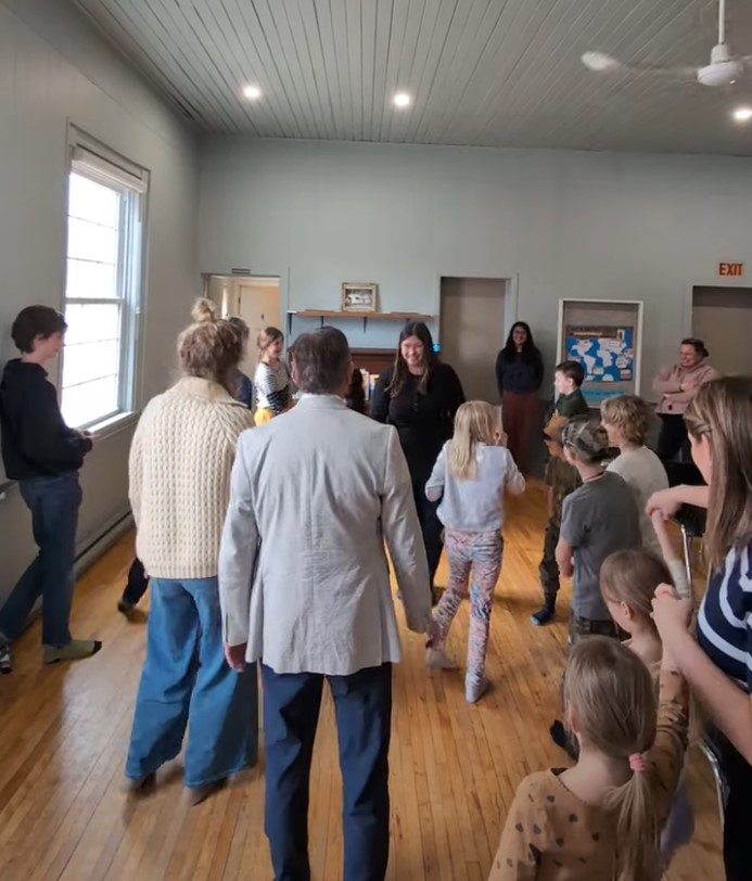 Leading attendees through a freeze dance party to international music.