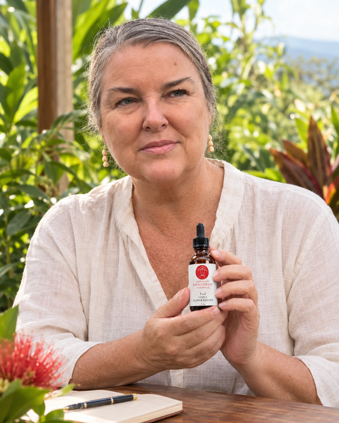 Hands gently holding flower essence drops.