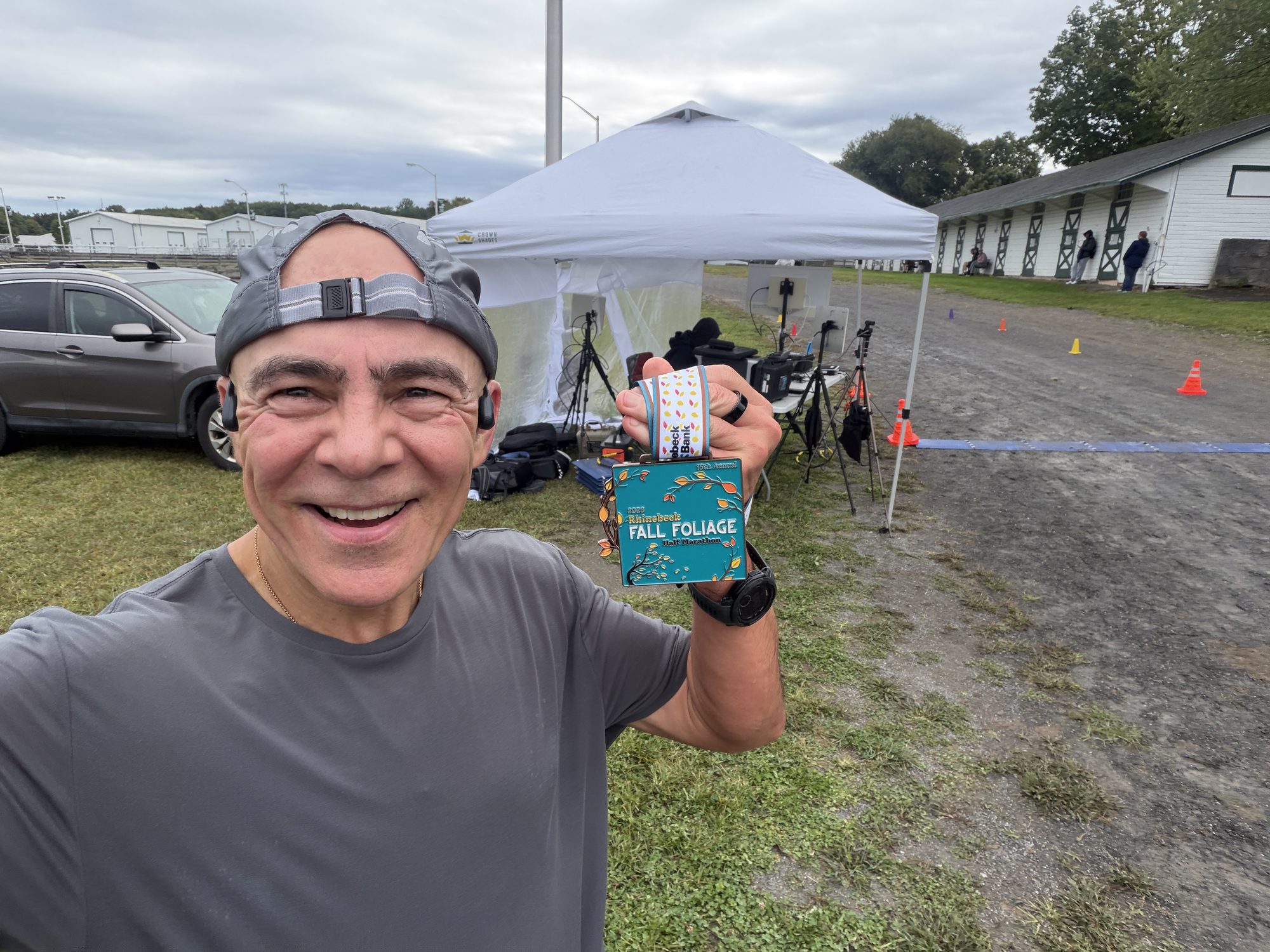 Igor holding his Rhinebeck Half Marathon 2026 finisher medal.