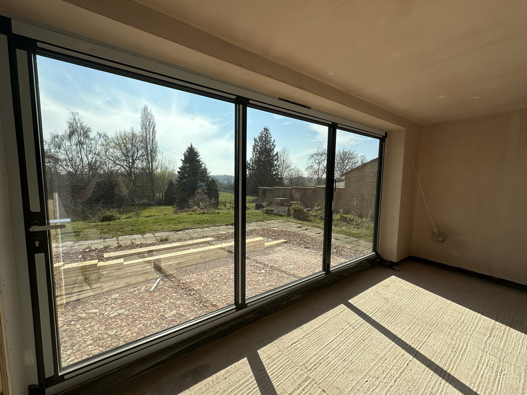Black aluminium bifold doors installed as part of the Solihull Road extension