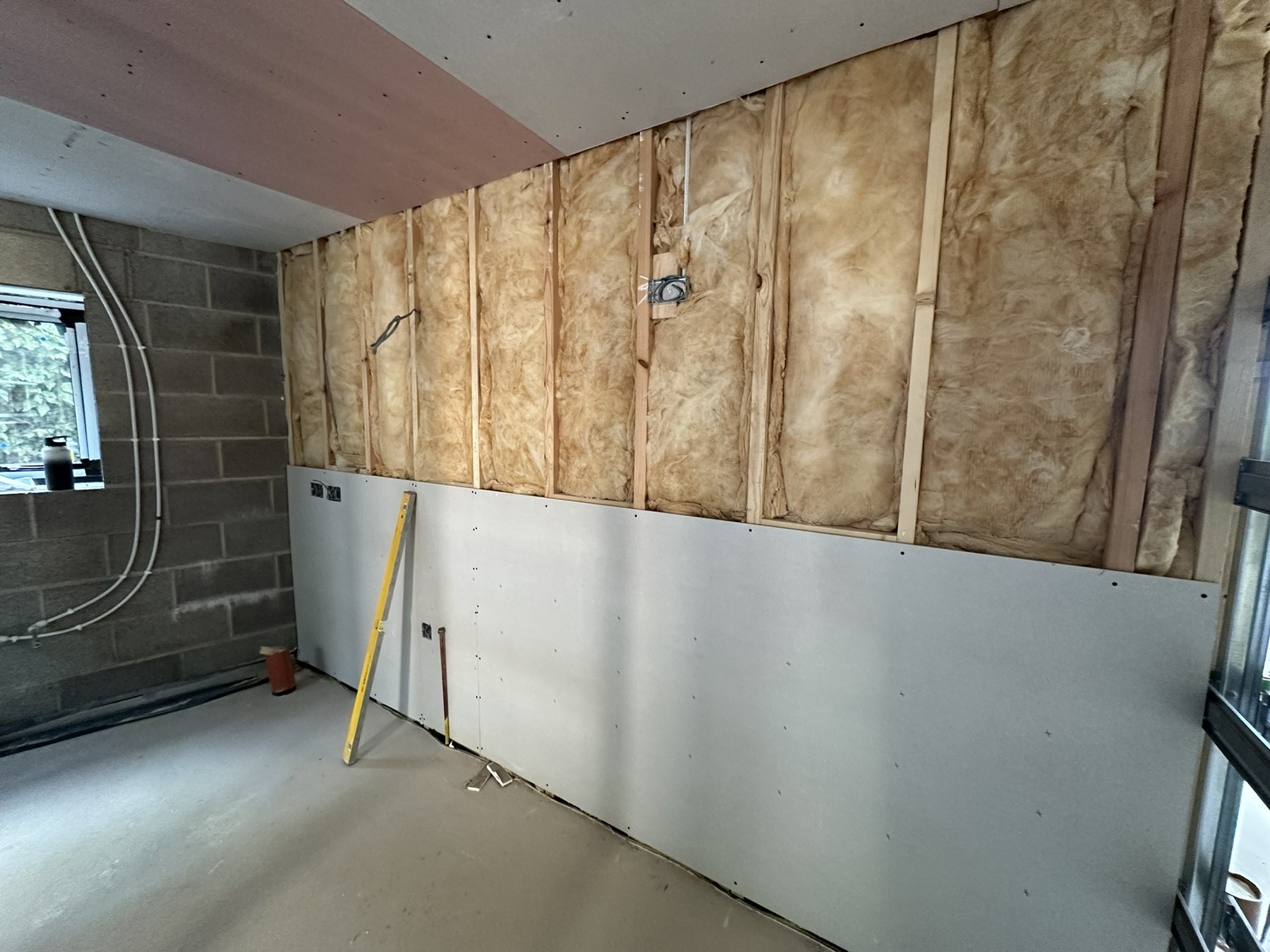 Insulated dry-lining system being installed at the Solihull Road renovation