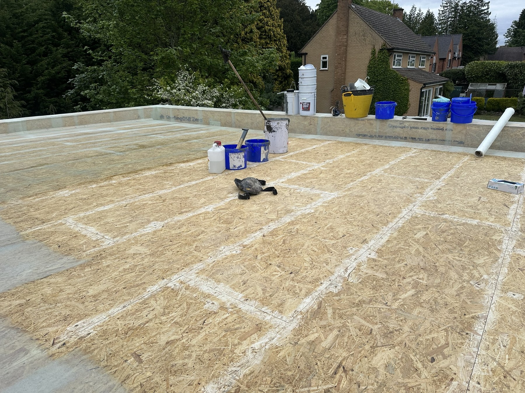 Fibreglass flat-roof installation in progress at the Solihull Road renovation