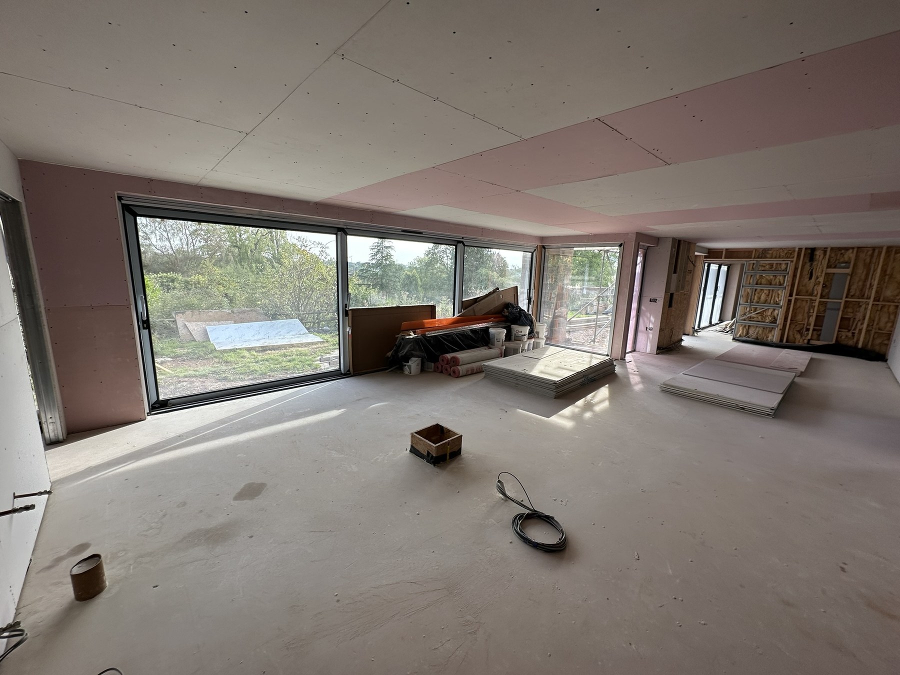 Open-plan interior being plasterboarded during the Solihull Road renovation