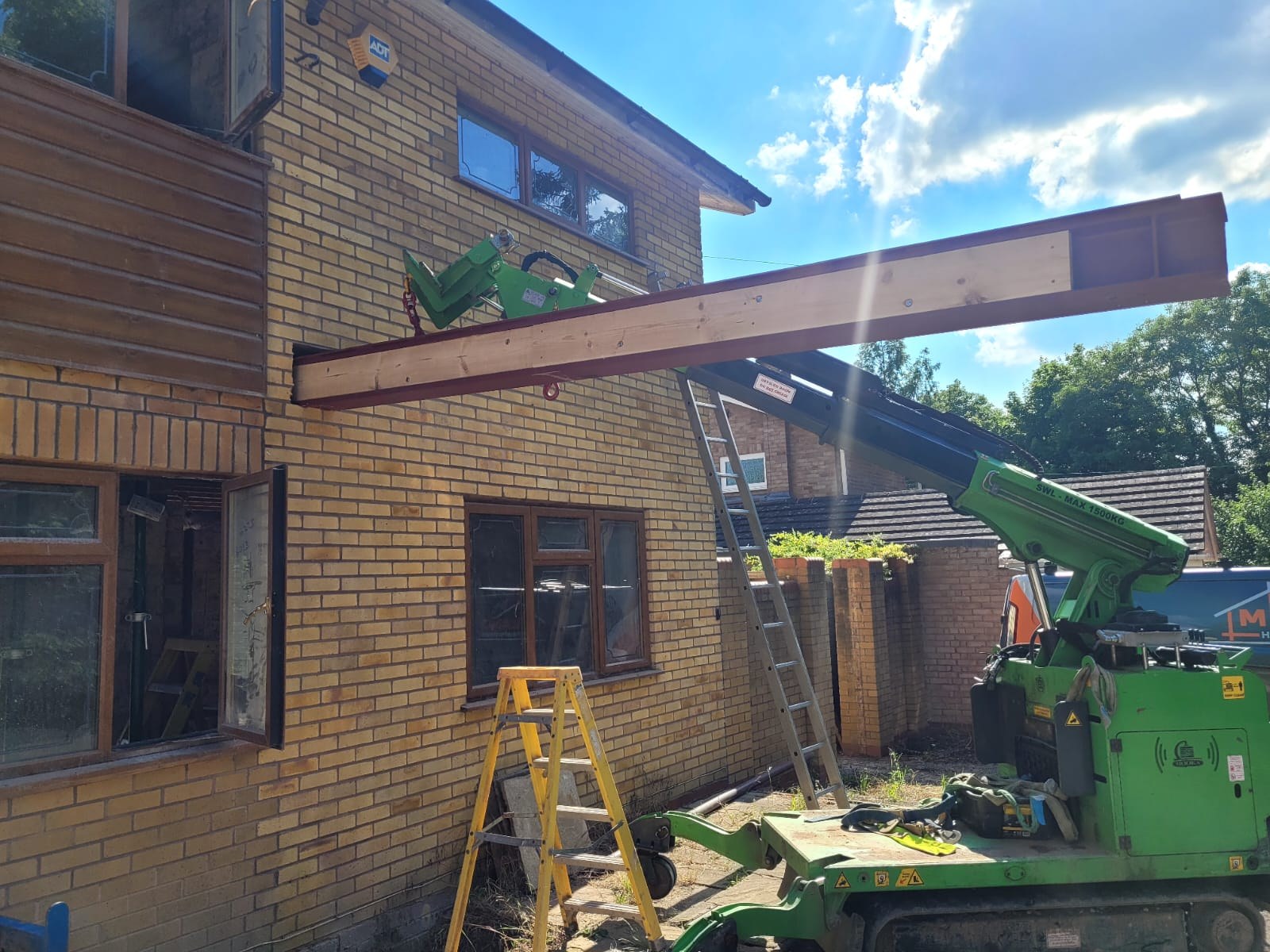 Steel beam being lifted into position during structural work at Solihull Road