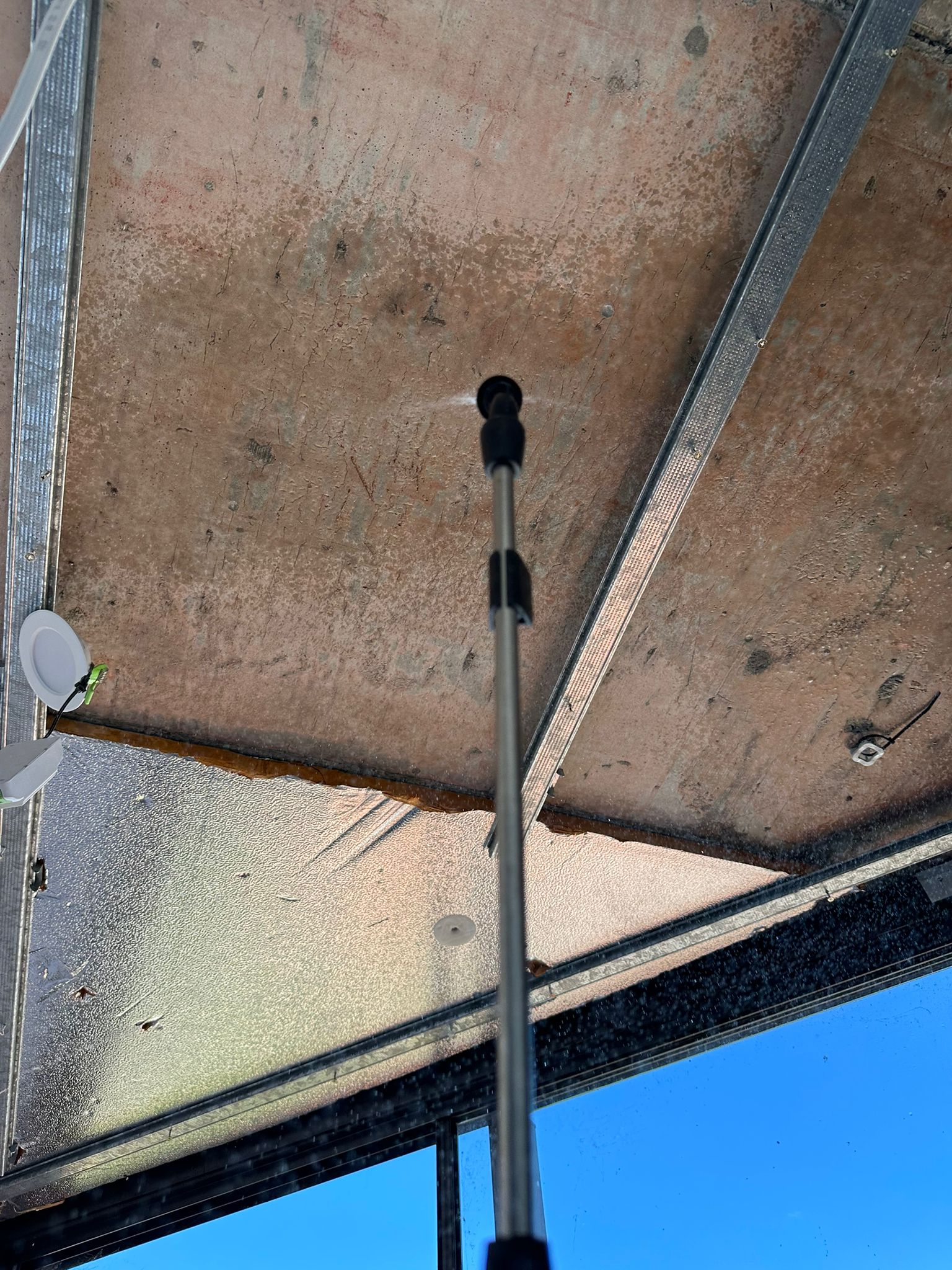 Mould contamination on ceiling near window and ventilation area caused by trapped moisture and poor airflow