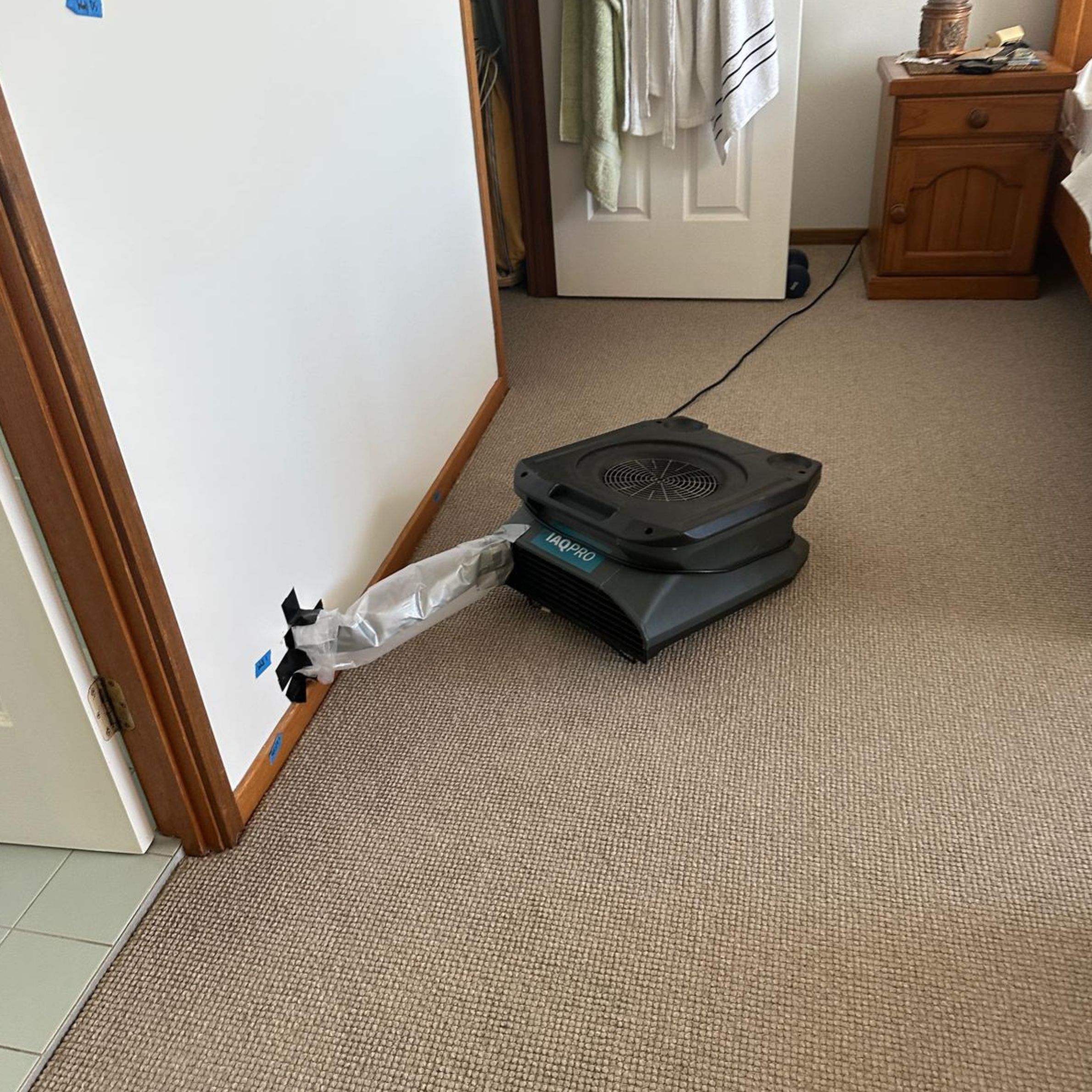 Ducted air mover drying hidden moisture inside the wall cavity after water damage from a burst flexi hose in Bateau Bay. Ducted air mover drying hidden moisture inside the wall cavity after water damage from a burst flexi hose in Bateau Bay.