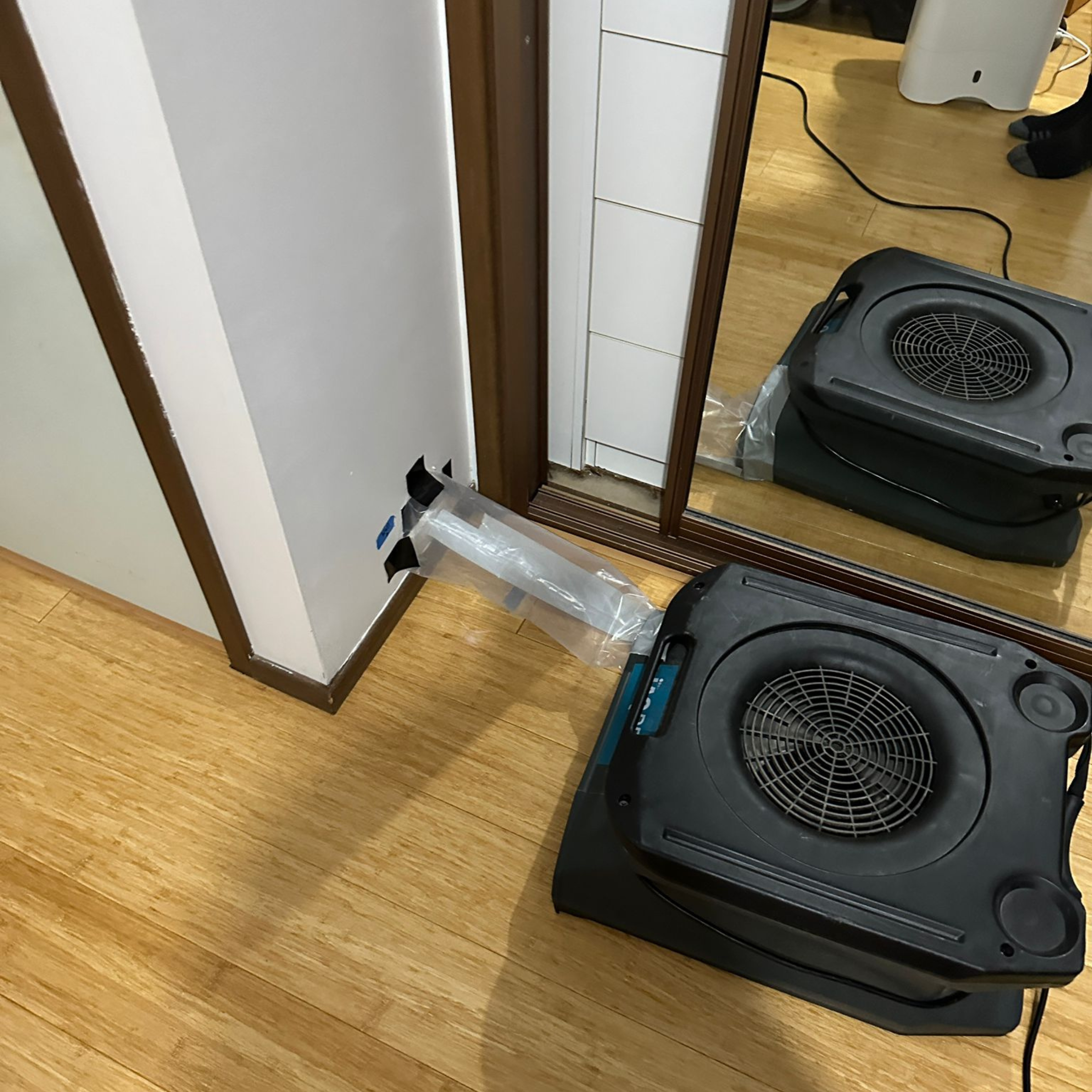 Structural drying equipment installed after burst pipe water damage in Fairfield home, drying ensuite, bedroom, walls and carpeted areas.