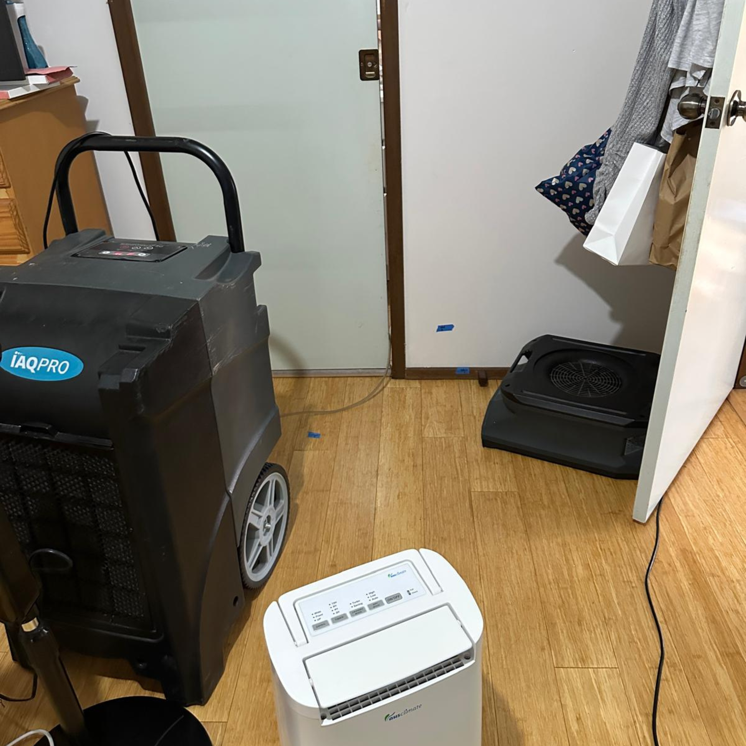 Structural drying equipment installed after burst pipe water damage in Fairfield home, drying ensuite, bedroom, walls and carpeted areas.