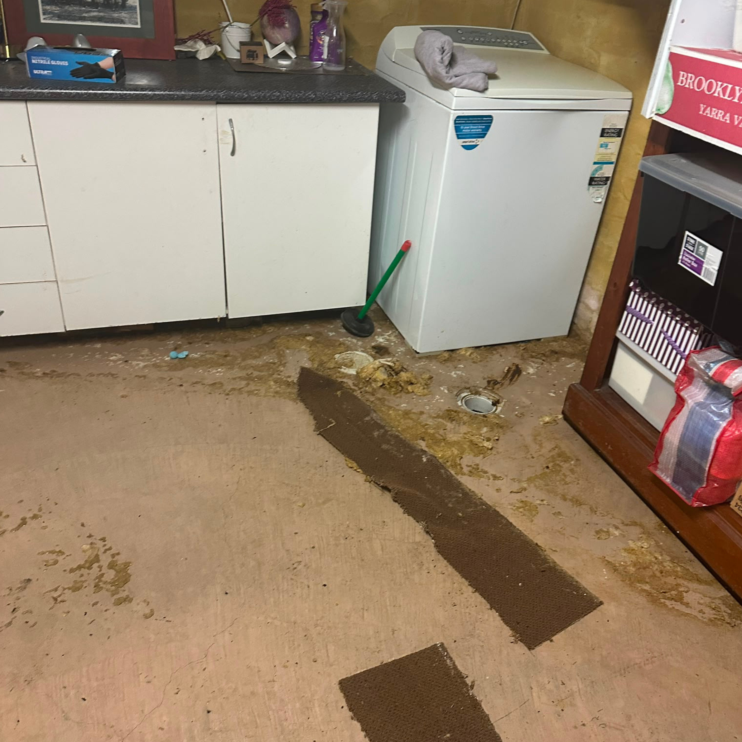 Garage floor before sewer overflow clean up in Cronulla, NSW