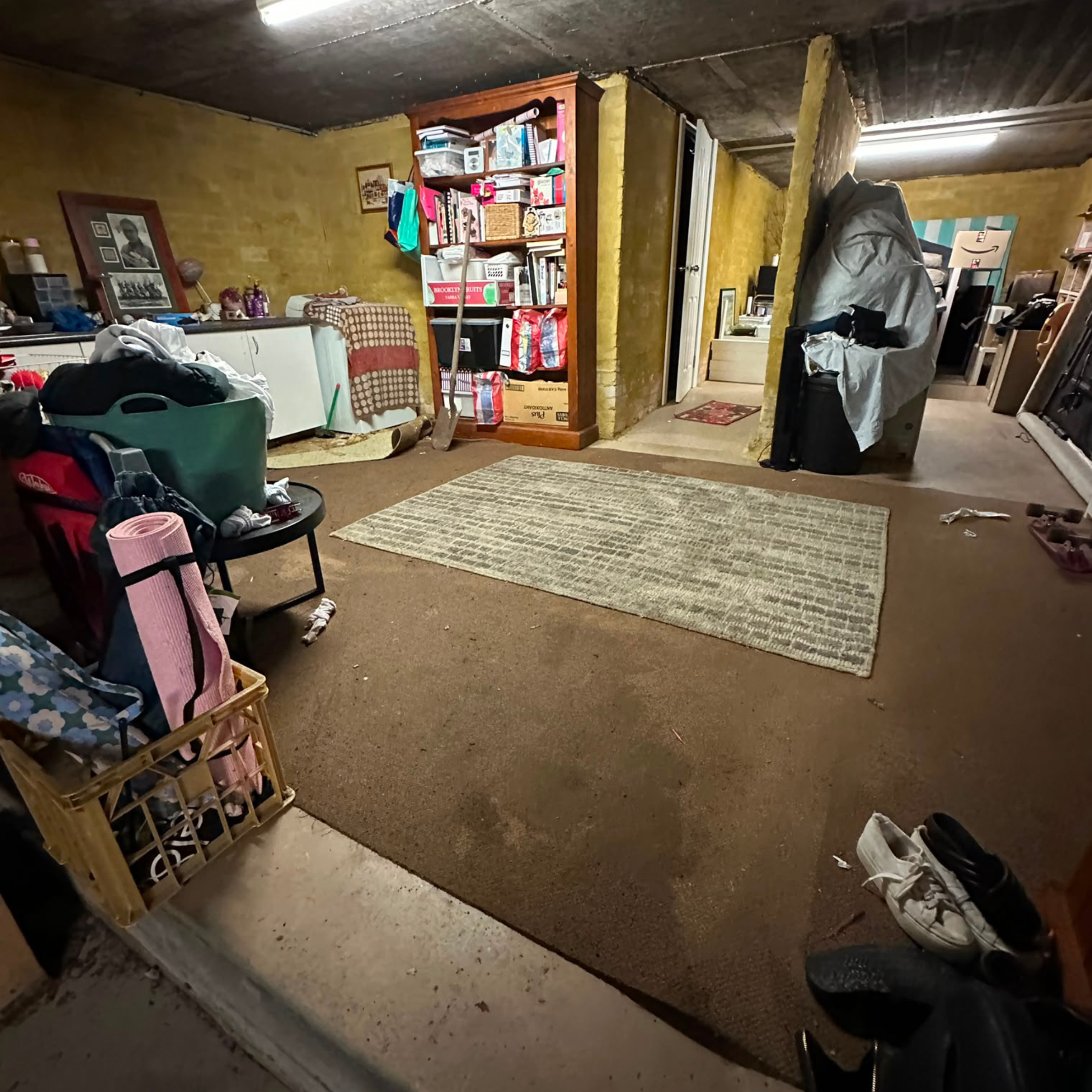 Affected garage carpet before removal after a sewer overflow in Cronulla, NSW