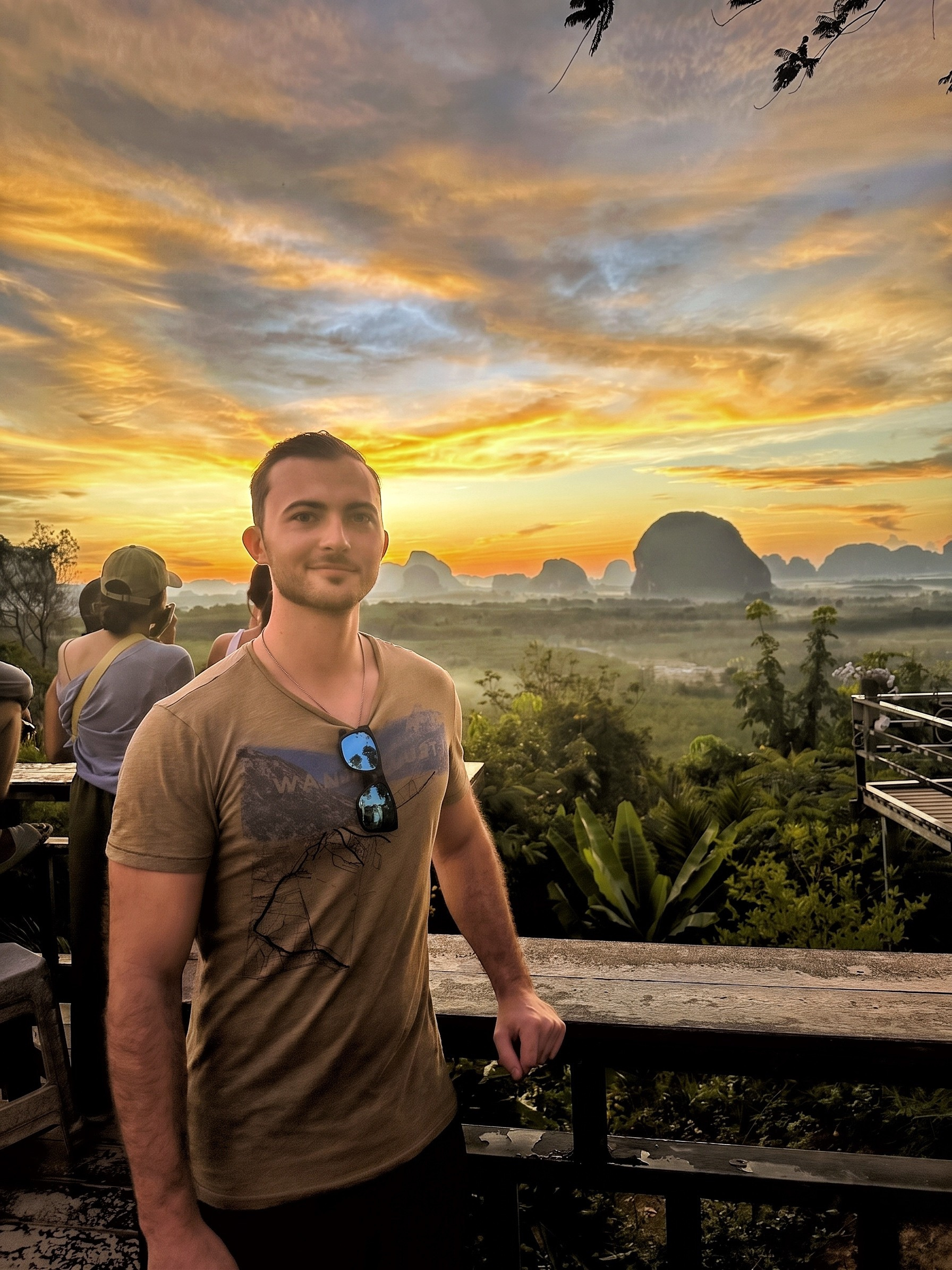 Jordan watching the sunrise over a Thai landscape