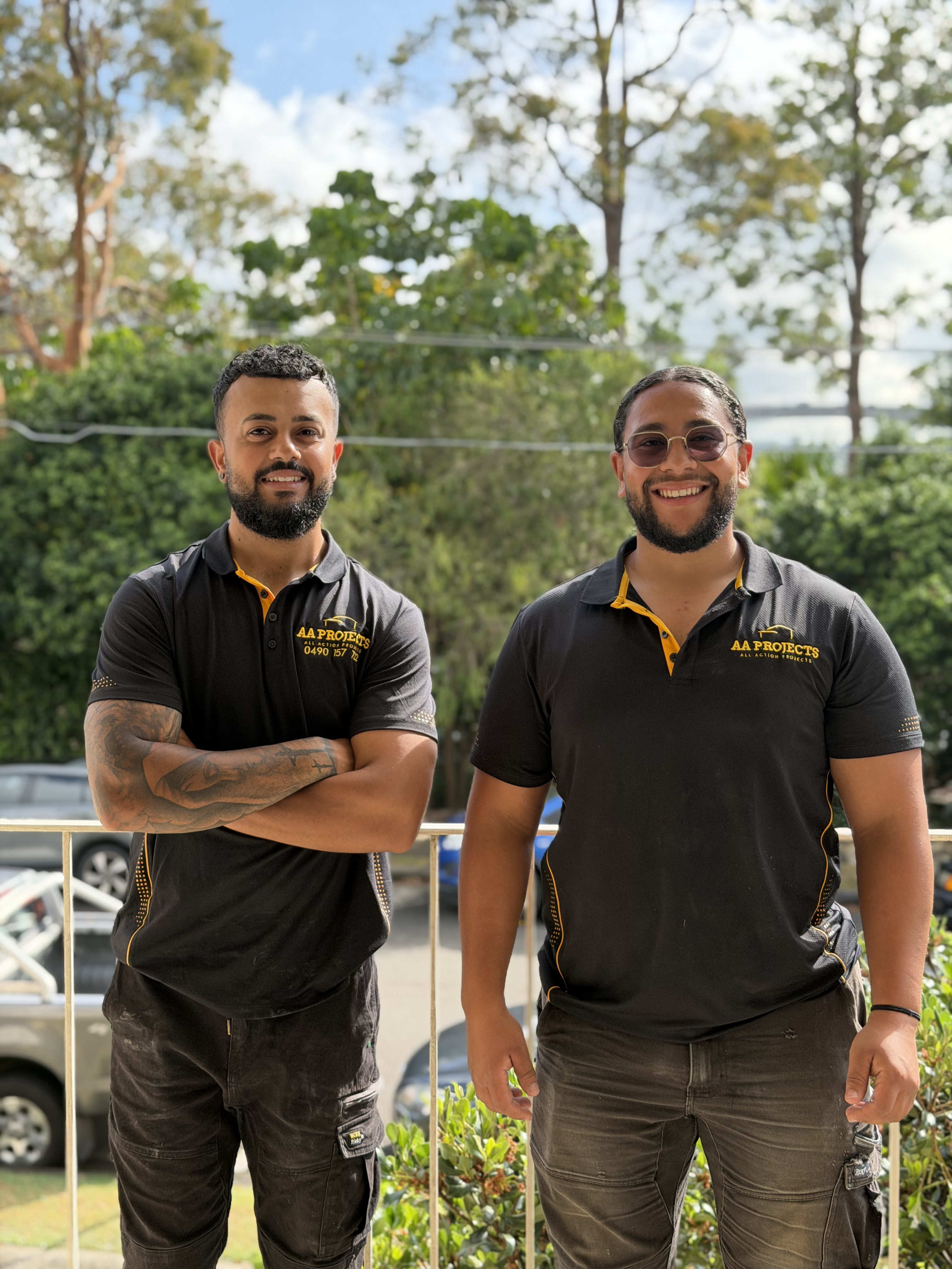 Abraam and Andrew from AA Projects in their work uniforms