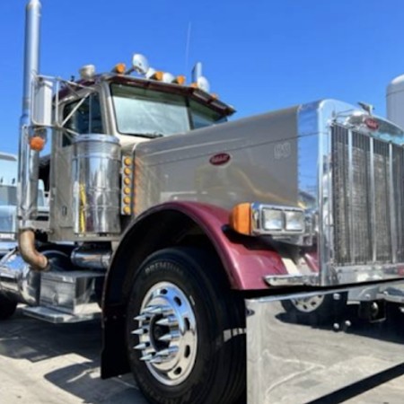 Mobile diesel technician repairing heavy duty commercial truck