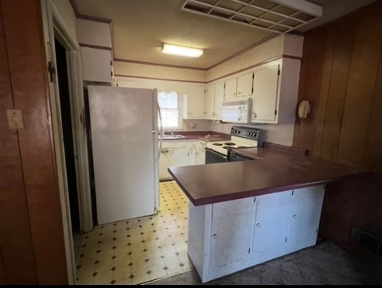 Kitchen remodel with new cabinetry, countertops, and a finished island — after