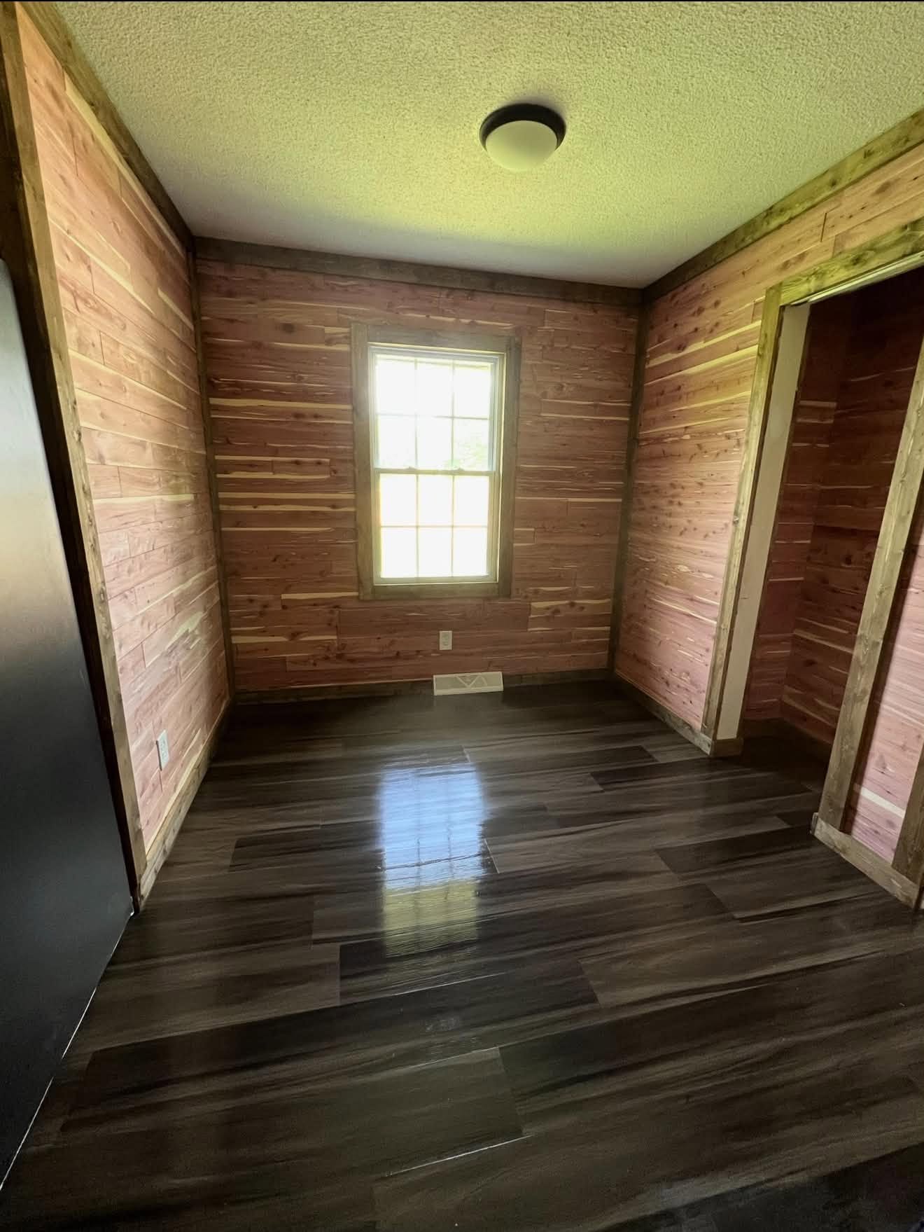 Adding Tongue and Groove, updating trim, and flooring — before