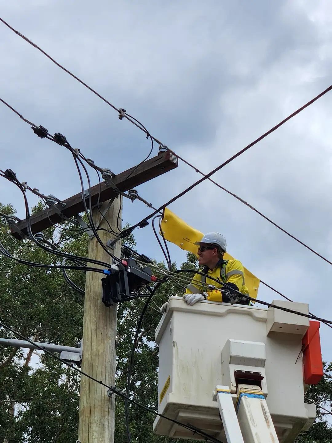 Level 2 electrician working on service mains