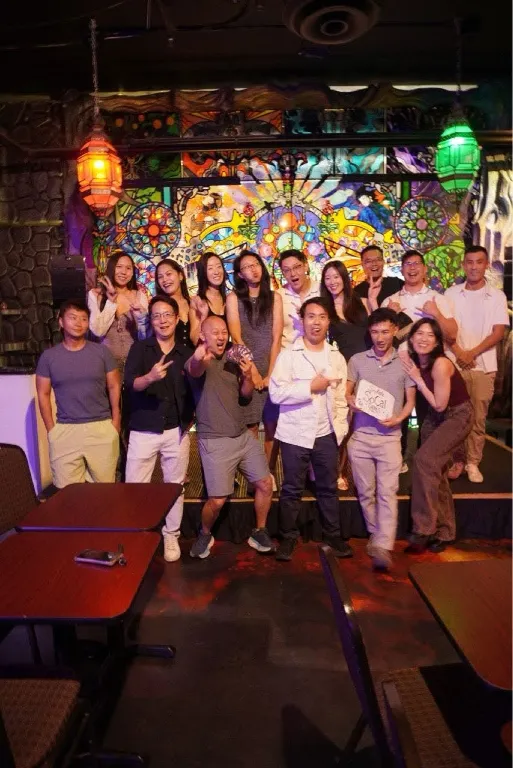 The group posing together with a Subtle SoCal Games sign