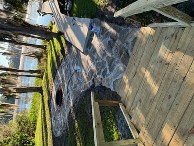 wood staircase with stone path