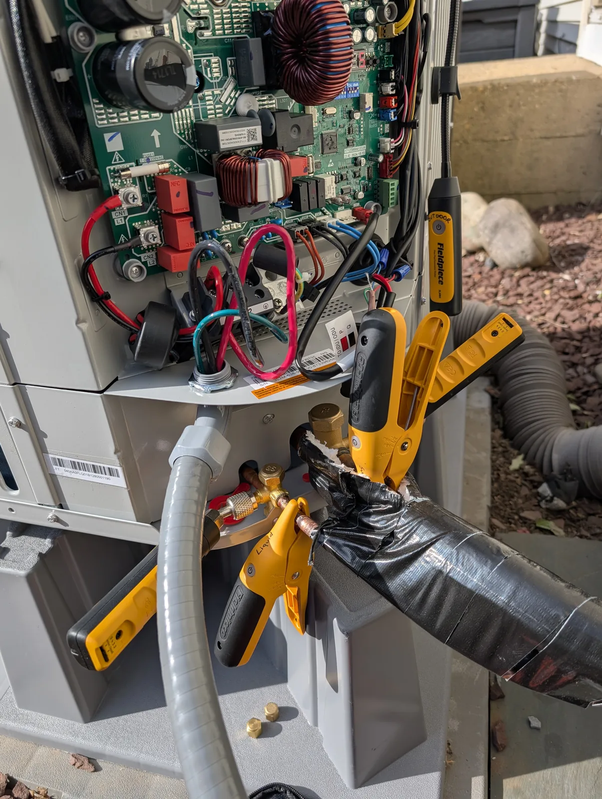 Open AC condenser control board during a repair in Monmouth County, NJ