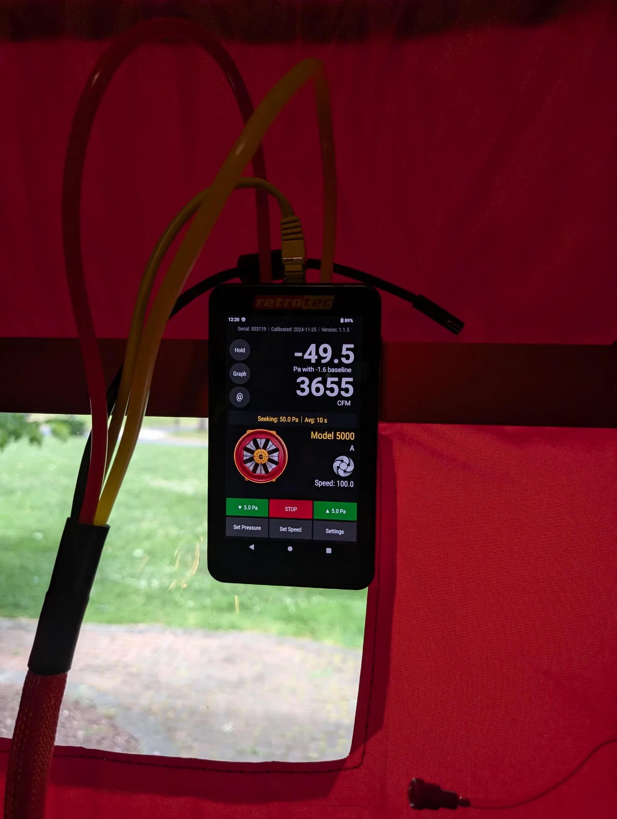 Blower door gauge measuring home air leakage during a Freehold, NJ test