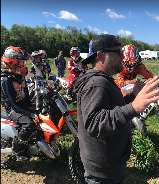 Scoob coaching a rider trackside