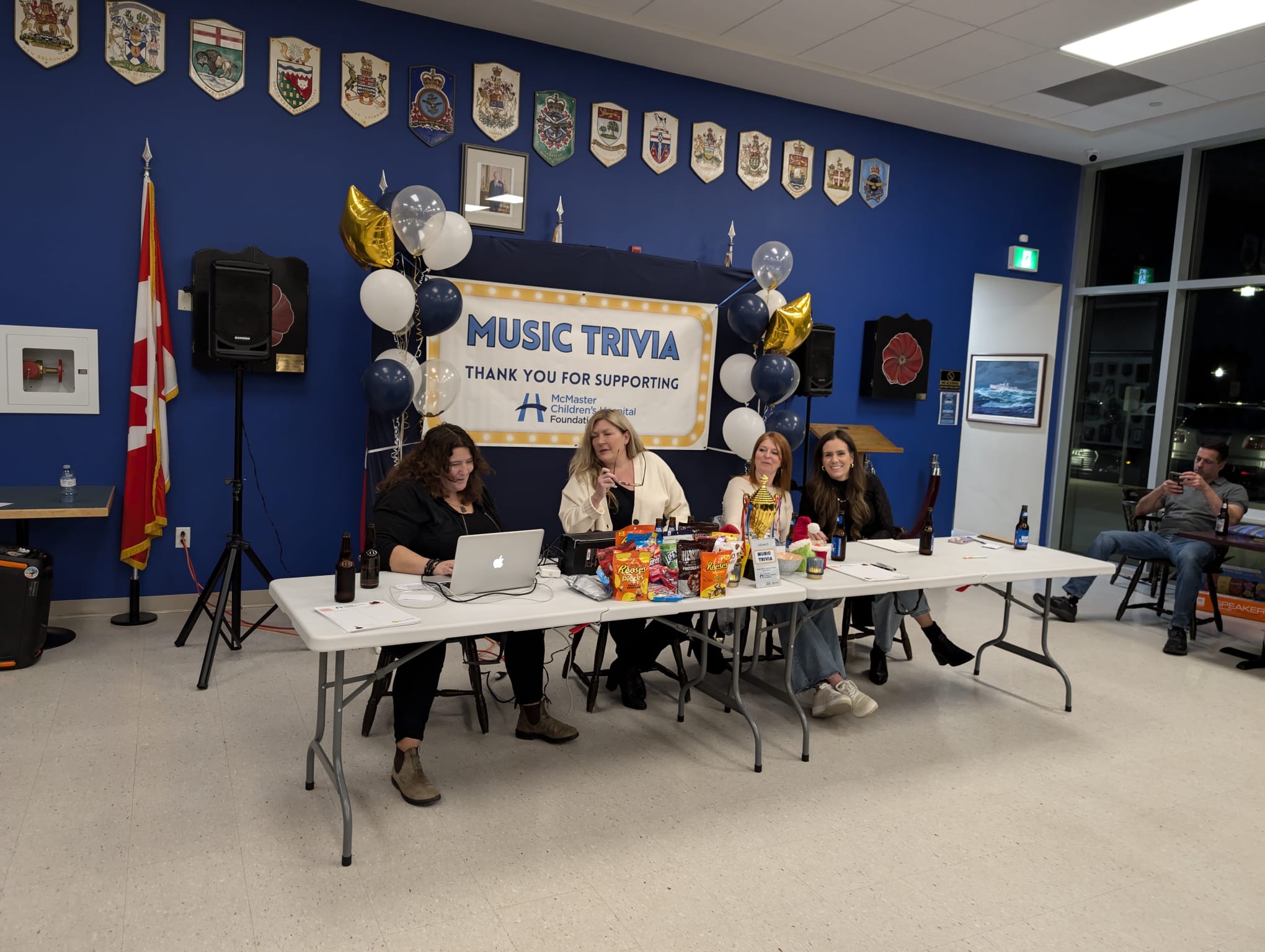 MC speaking on stage during the trivia night