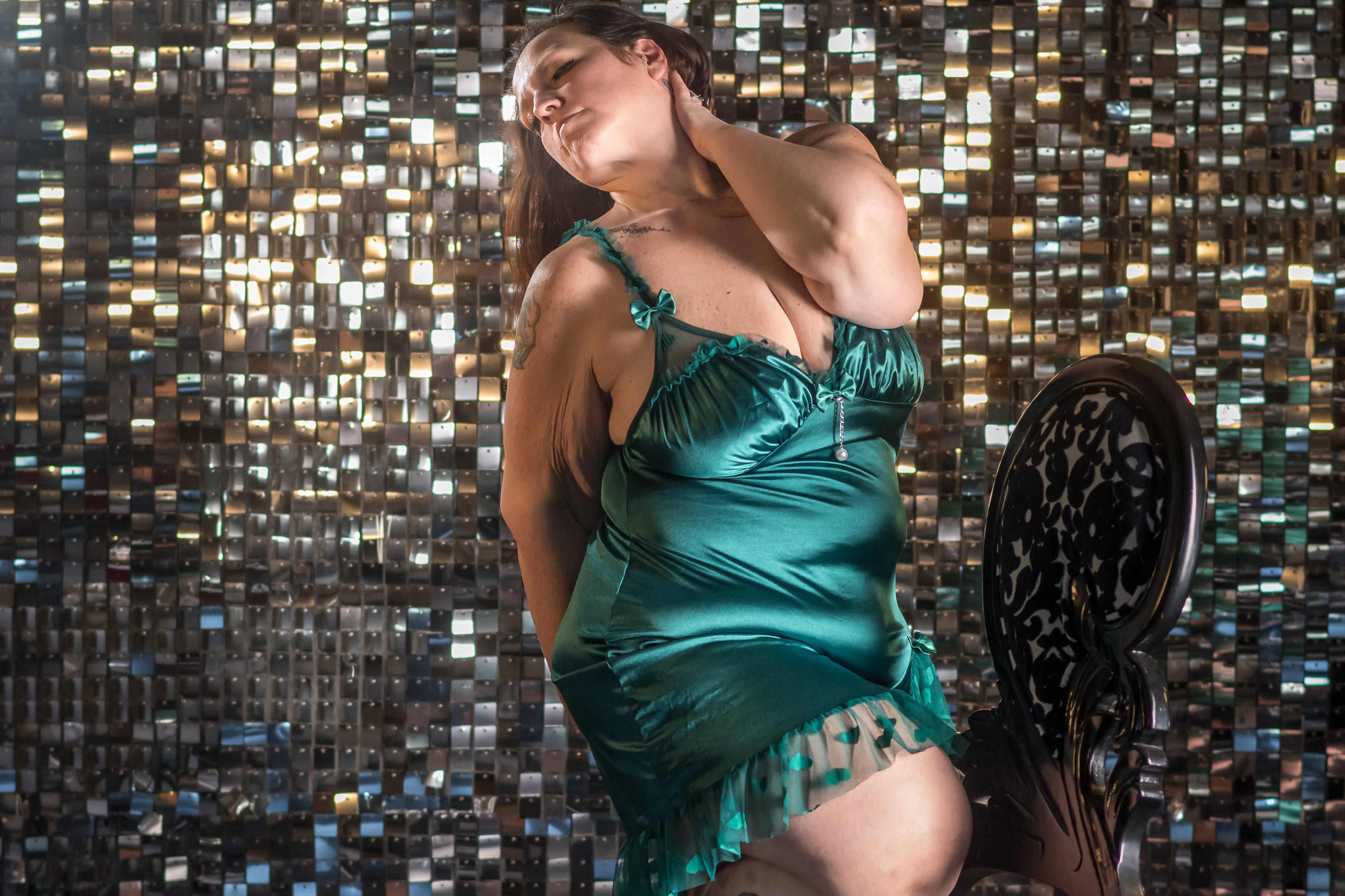 Claude responded: Woman in teal satin slip dress posing against shimmer wall during boudoir session at Body Beautiful Boudoir Columbus OhioWoman in teal satin slip dress posing against shimmer wall during boudoir session at Body Beautiful Boudoir Columbus Ohio