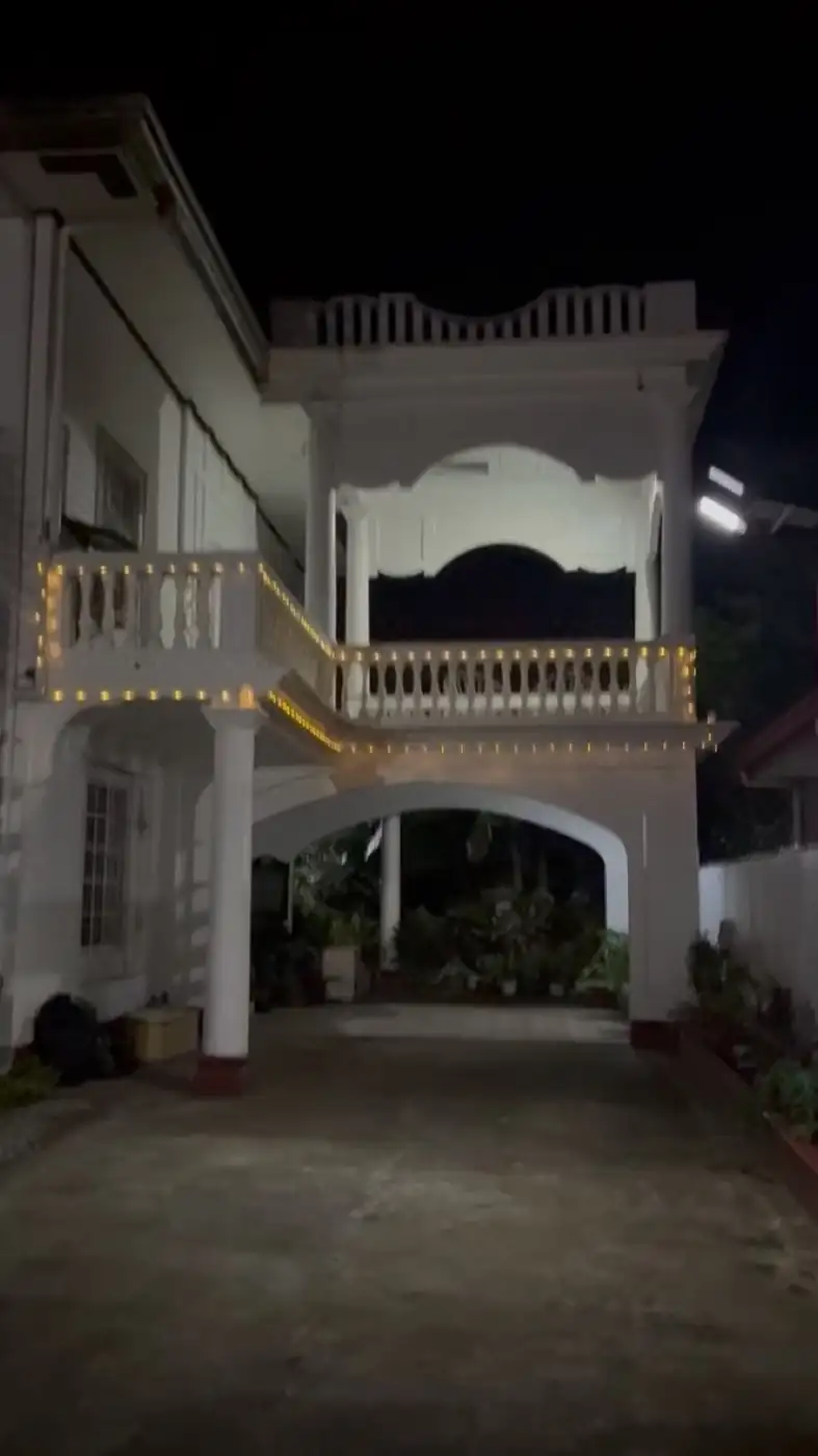 Balay Dako at night with string lights