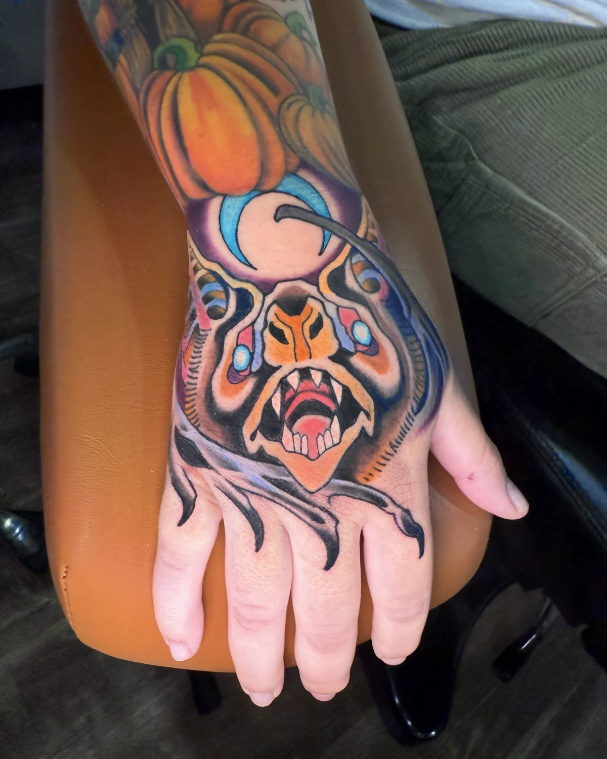 Black and grey moth hand tattoo by Nicole Miller in Missoula Montana